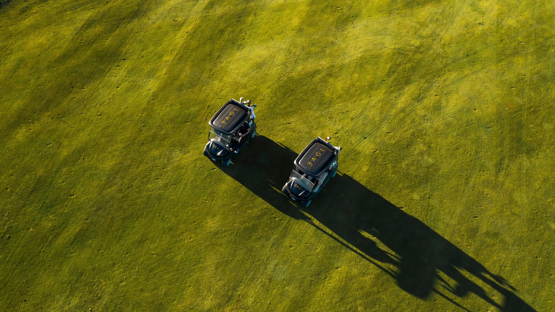 Premium golf cart fleet at golden hour